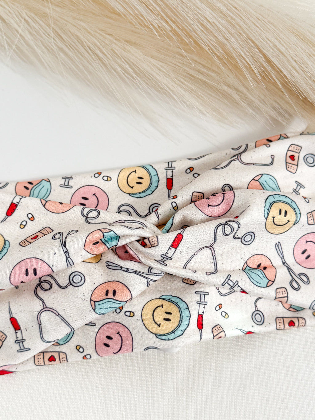 Medical smiles print twist headband for nurses and healthcare workers – handmade by Headband Studio