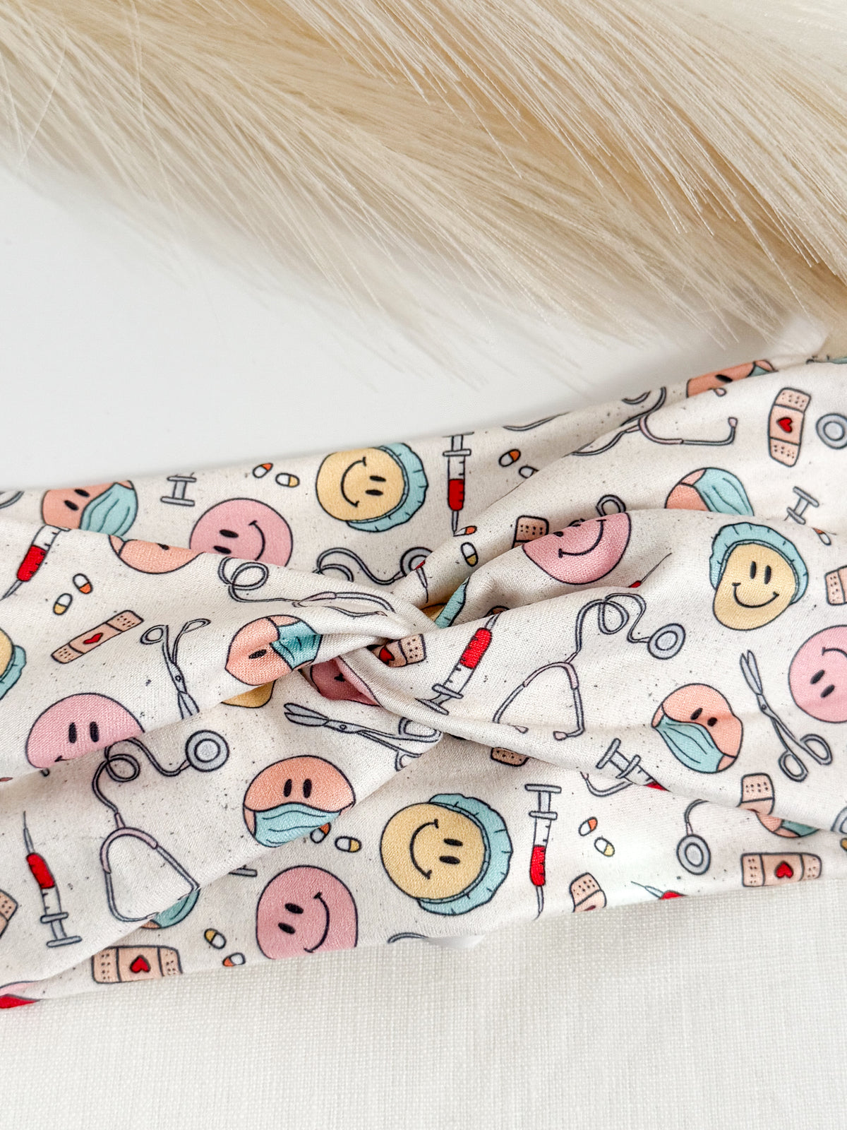 Medical smiles print twist headband for nurses and healthcare workers – handmade by Headband Studio
