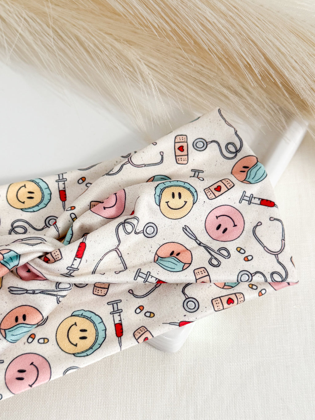 Medical smiles print twist headband for nurses and healthcare workers – handmade by Headband Studio