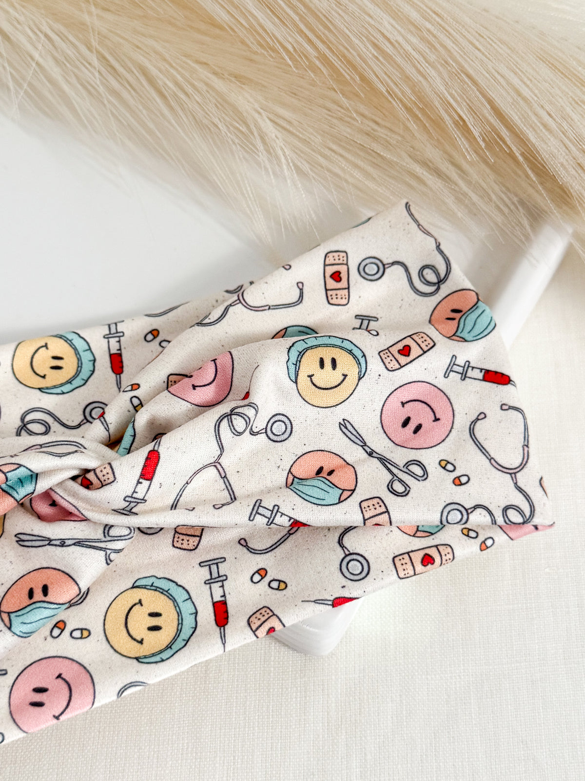 Medical smiles print twist headband for nurses and healthcare workers – handmade by Headband Studio