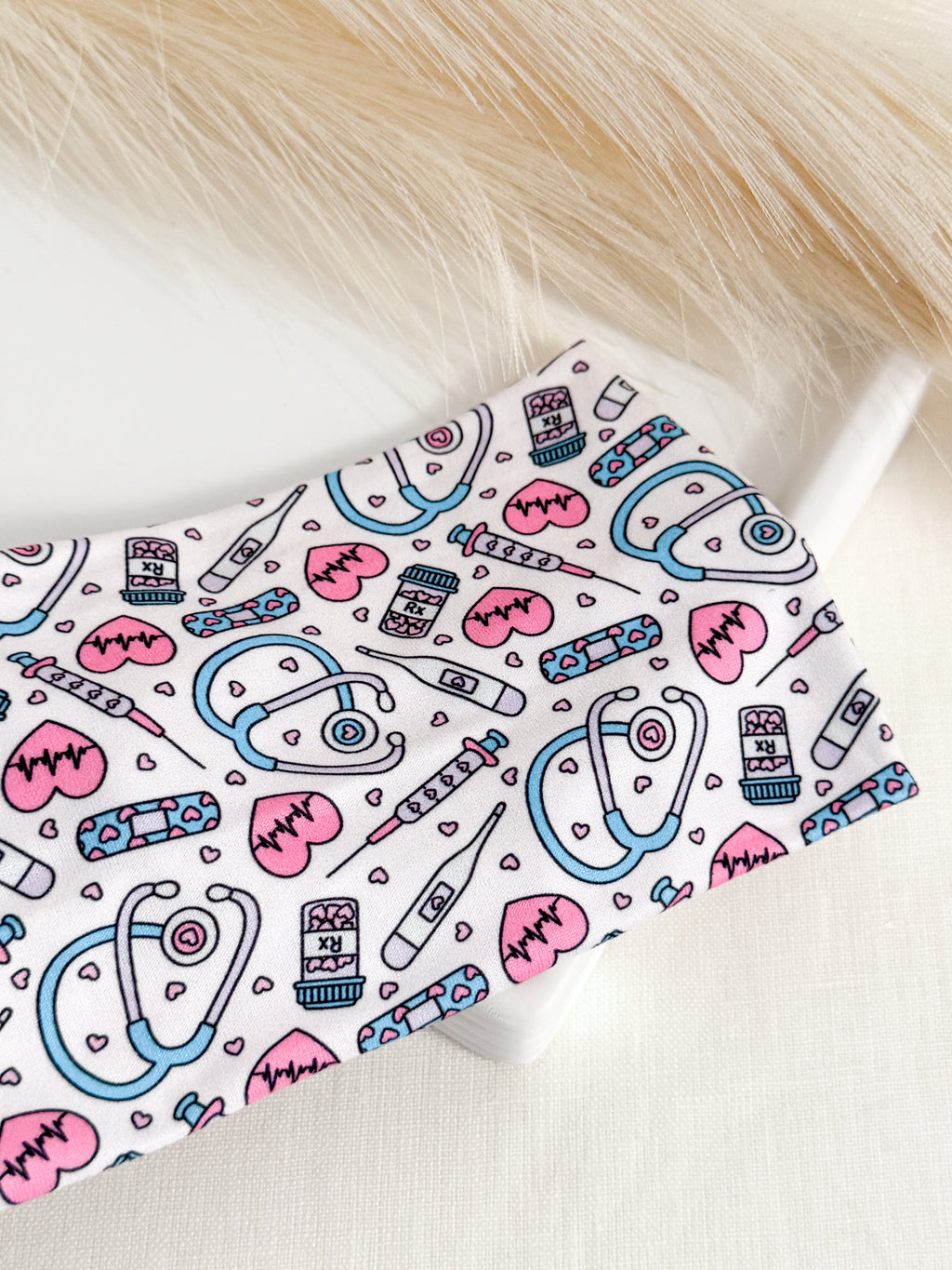 Pink twist headband for nurses – soft, non-slip, handmade by Headband Studio