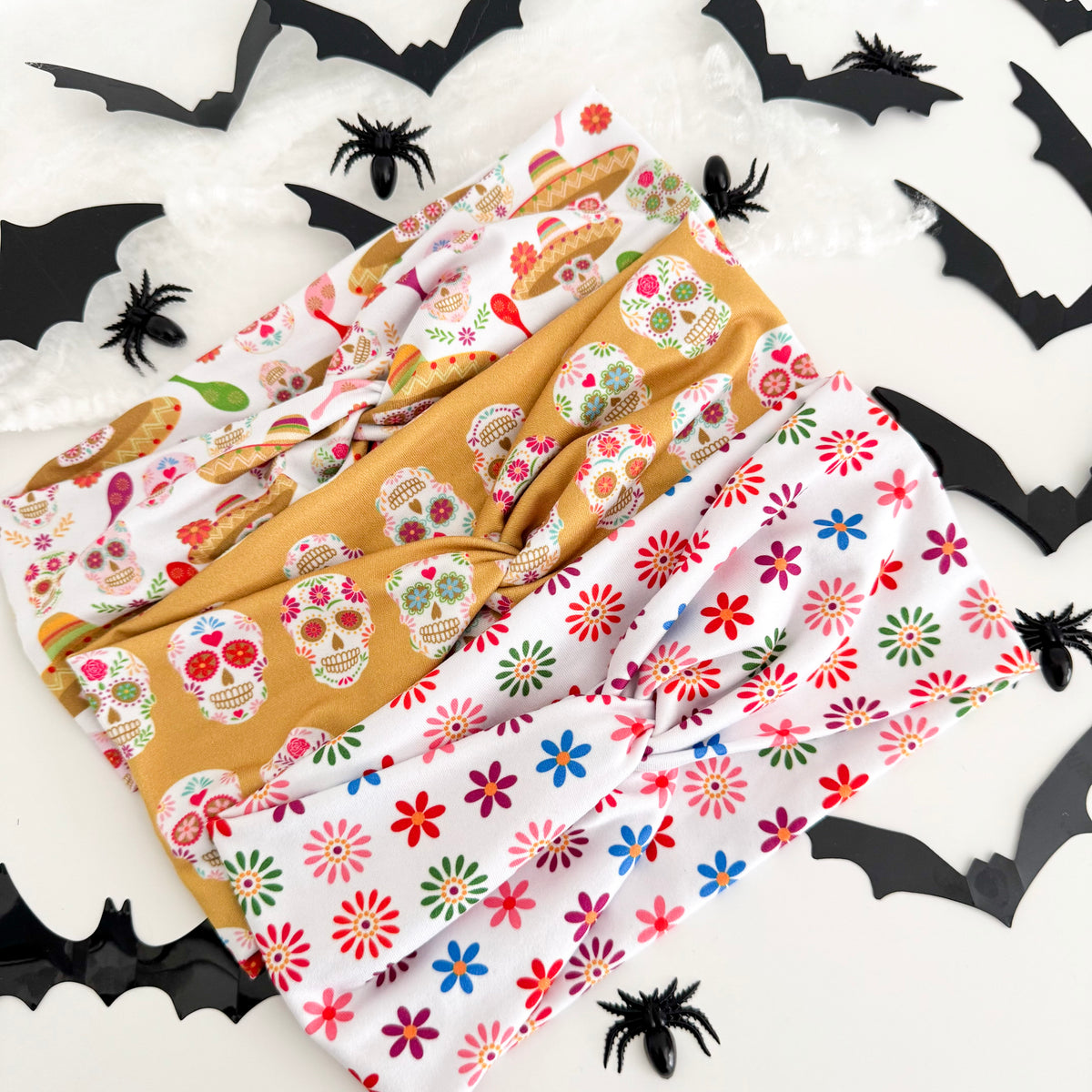 Three Day of the Dead twist headbands styled with Halloween bats and spiders