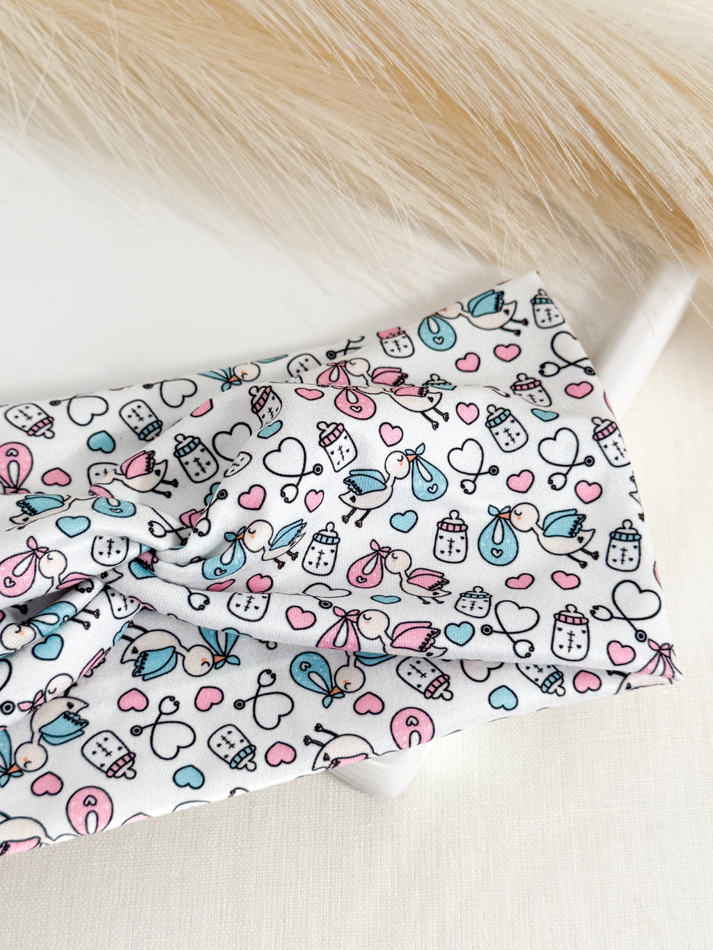 Baby stork print twist headband for labor & delivery nurses – handmade by Headband Studio