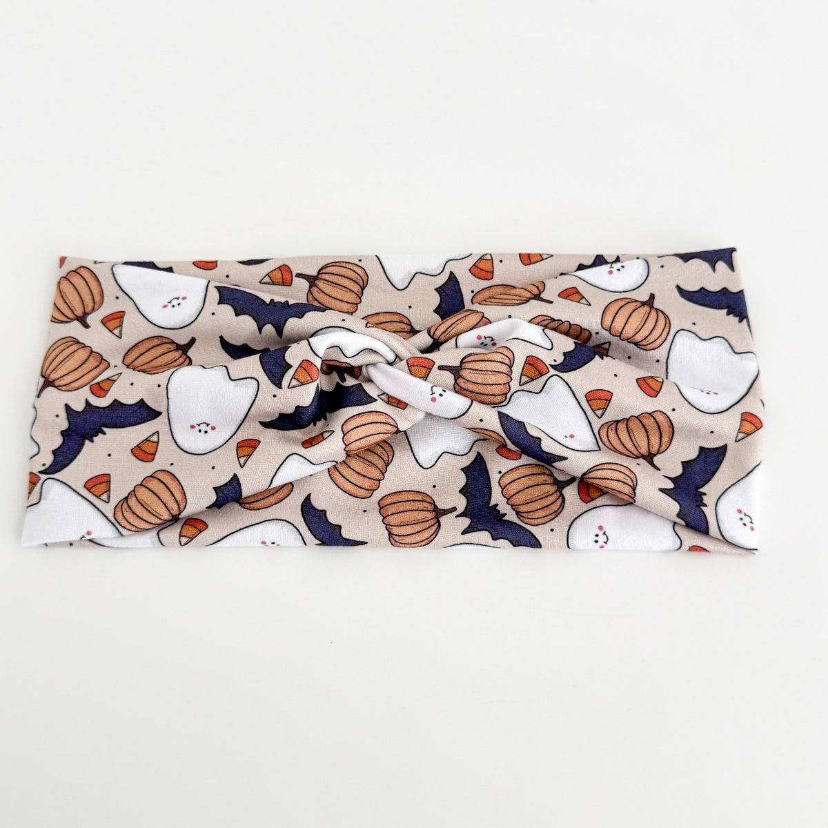 Ghost and Pumpkins twist headband with ghosts, pumpkins and bats on beige