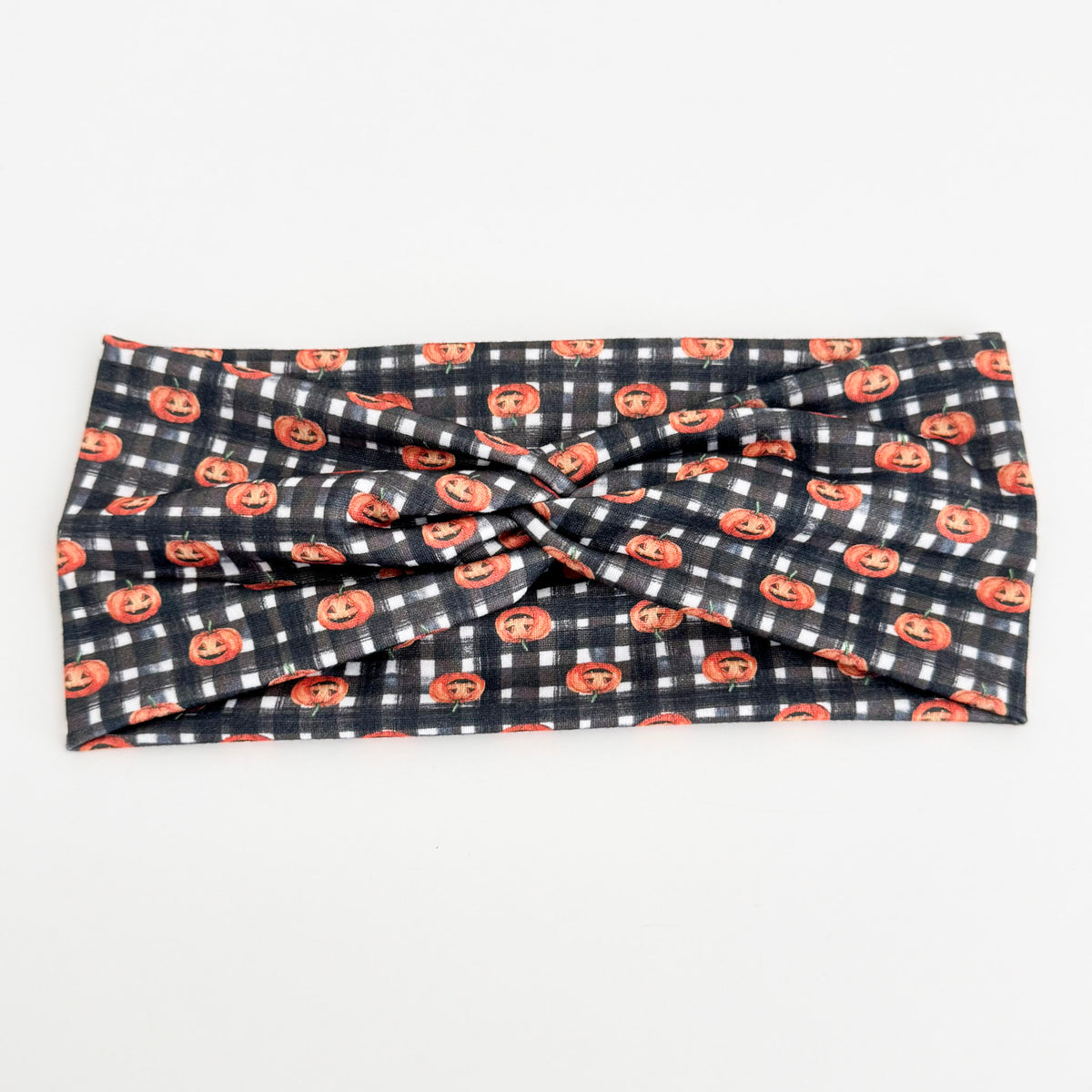 Gingham Pumpkin twist headband with tiny pumpkins on black and white gingham