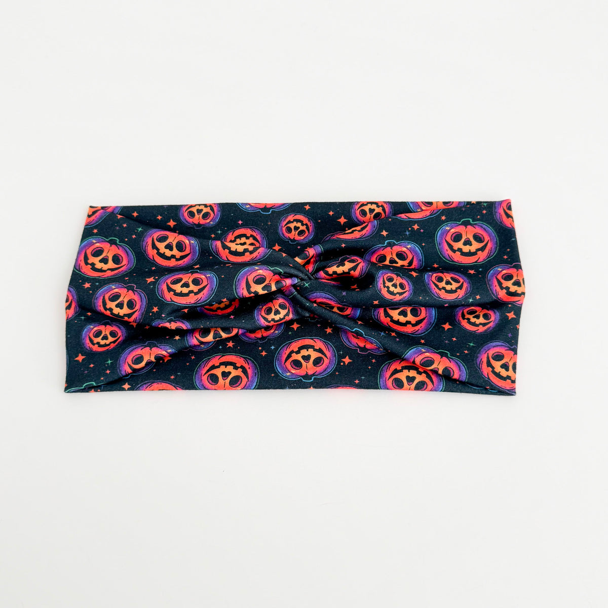 Glowing Jack-o'-Lanterns twist headband with pumpkin faces on navy