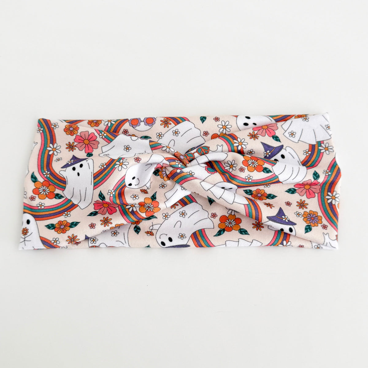 Groovy Ghost twist headband with retro ghosts, rainbows, mushrooms and flowers