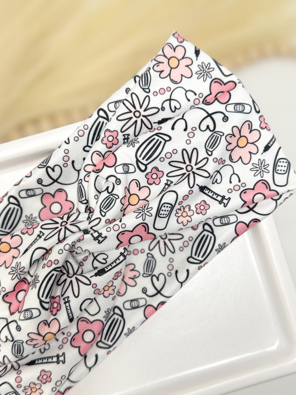 Medical flowers print twist headband for nurses and healthcare workers – handmade by Headband Studio