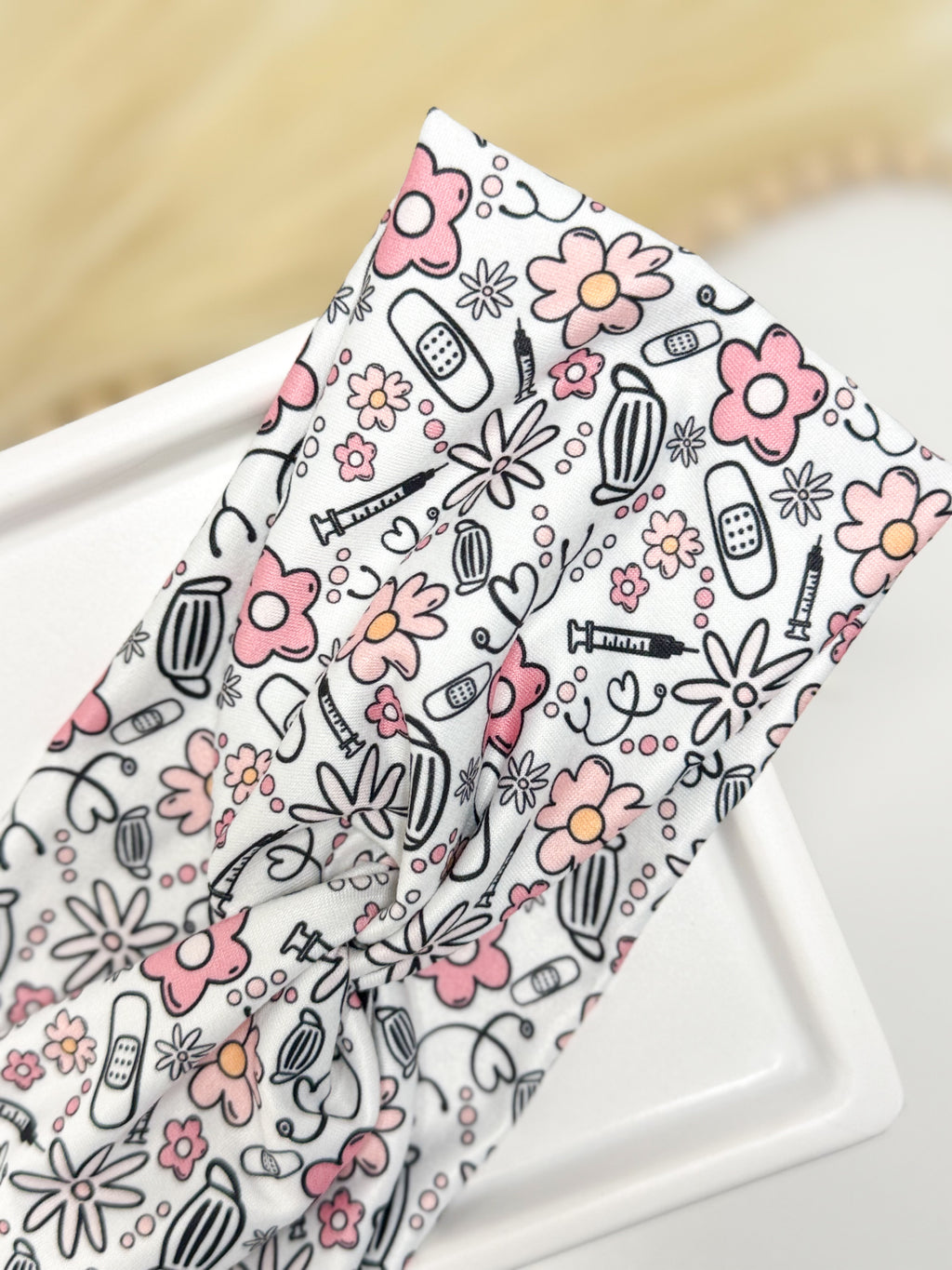 Medical flowers print twist headband for nurses and healthcare workers – handmade by Headband Studio