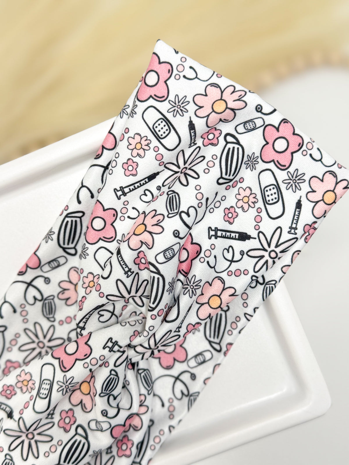 Medical flowers print twist headband for nurses and healthcare workers – handmade by Headband Studio
