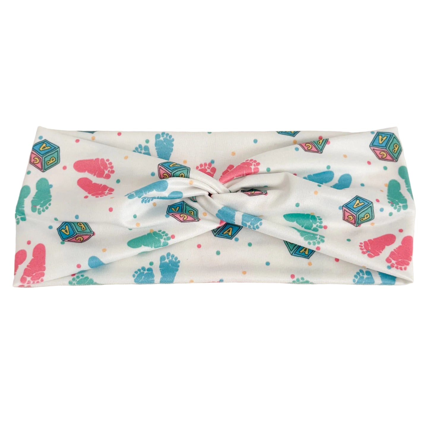 Headband with colorful baby footprint and block pattern on a white background