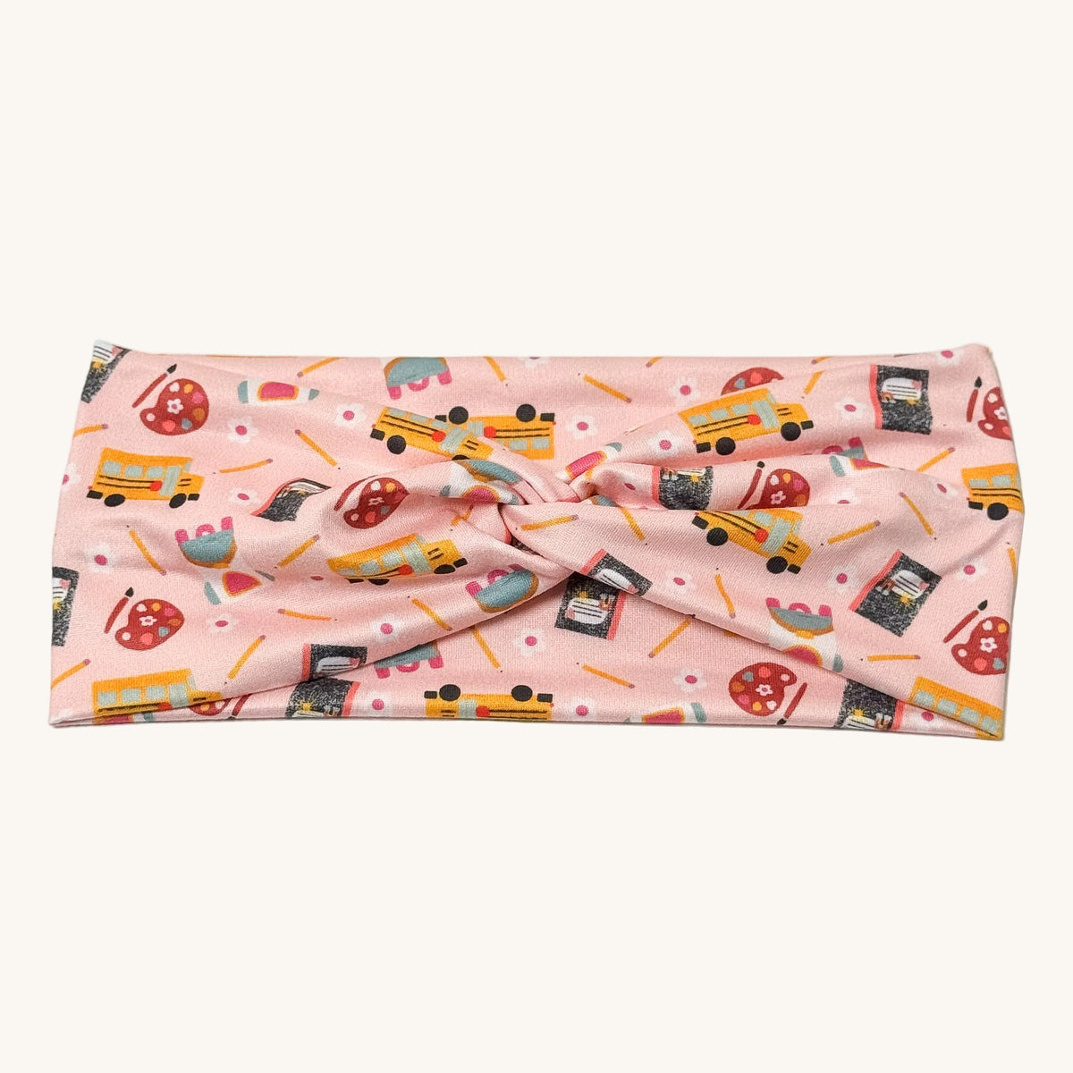 Blush pink school bus print knotted headband for teachers – handmade by Headband Studio
