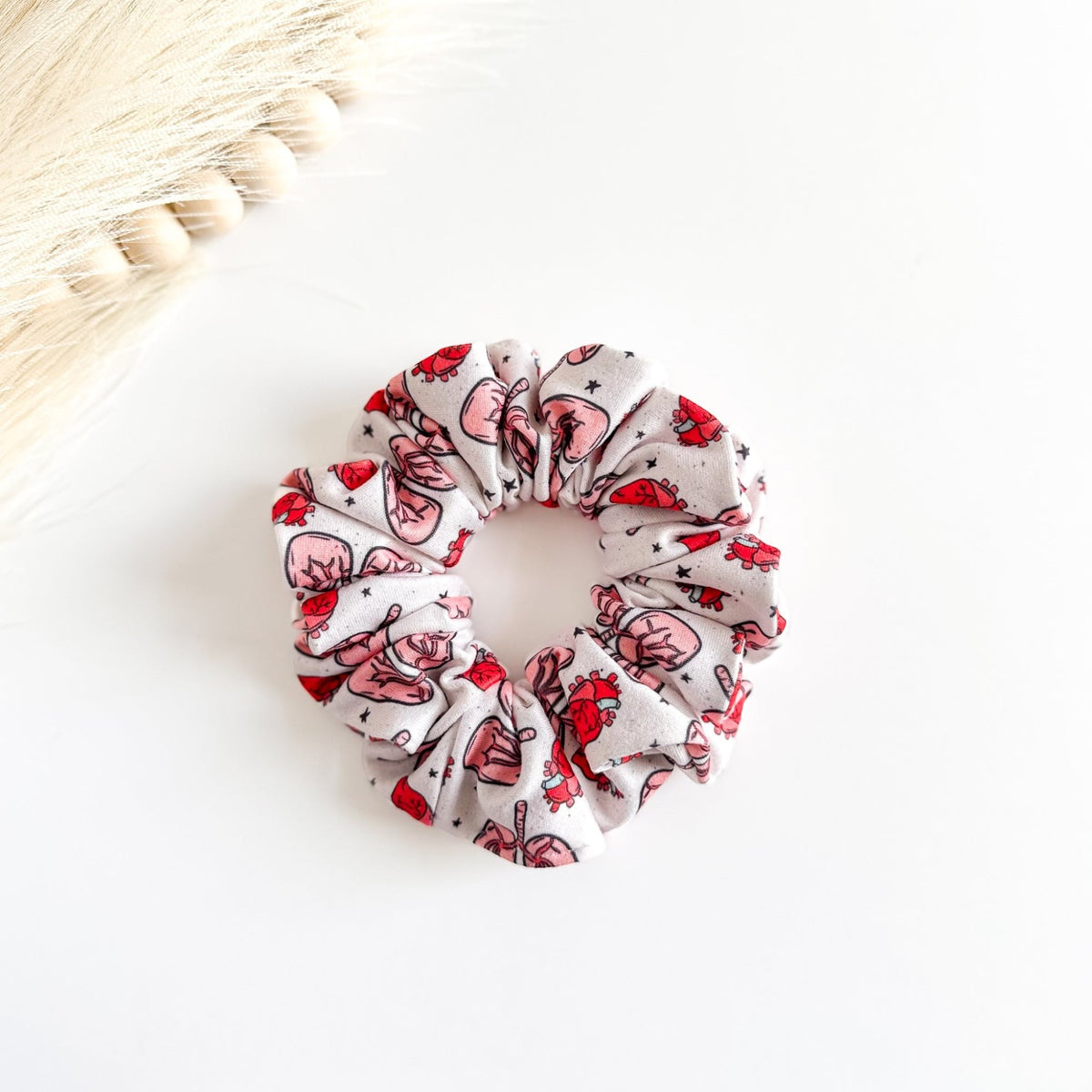 Headband Studio white scrunchie with red Lungs & Hearts made of soft fabric for medical professionals.