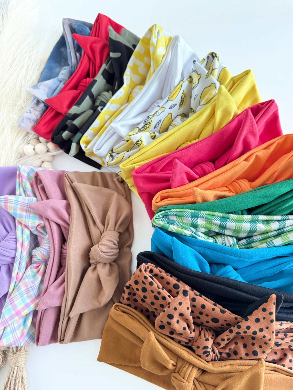 Headband Studio collection of soft, adjustable tie headbands in various colors and patterns like plaid, leopard, and solid brights.