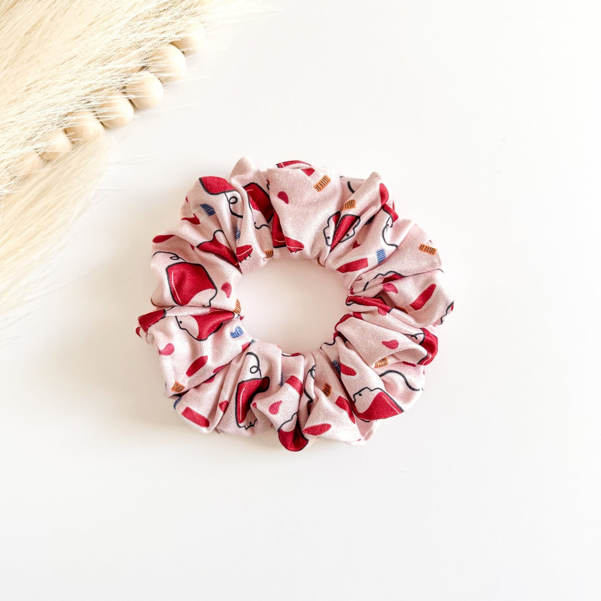 Headband Studio light pink scrunchie with a red bags of blood and tubes 