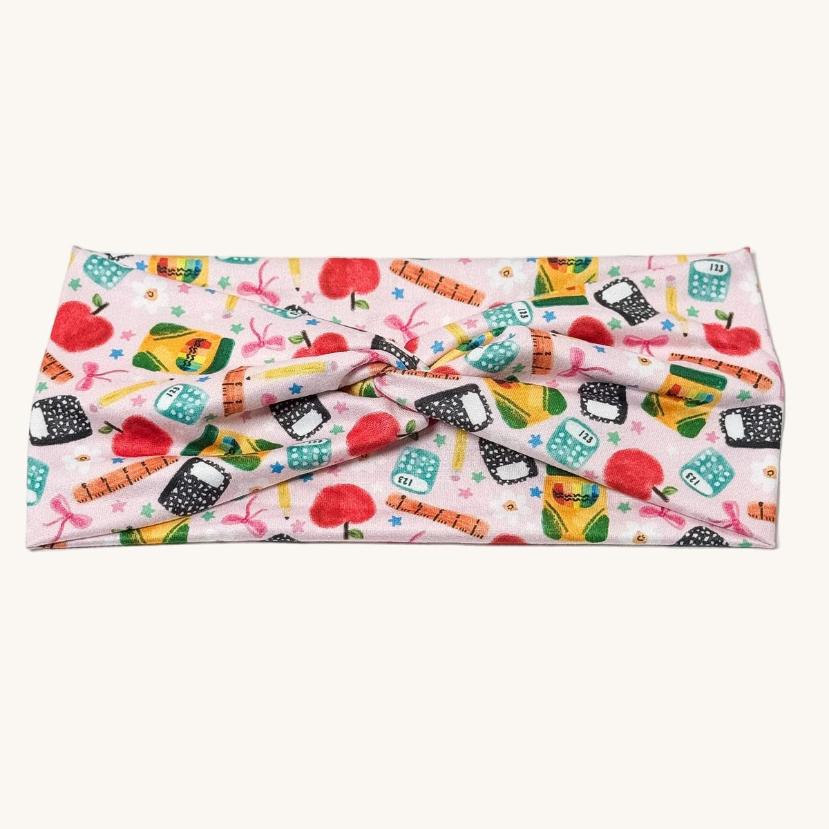 Pink school-print knotted headband for teachers – handmade by Headband Studio