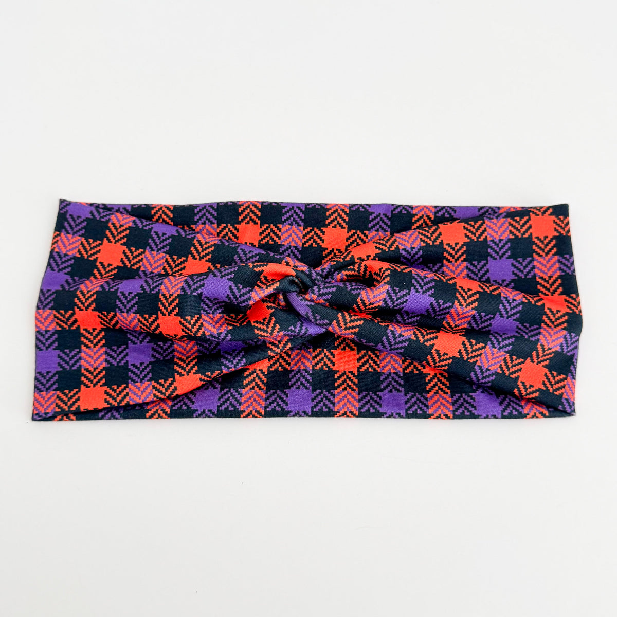 Purple and Orange Plaid twist headband in purple, orange and black plaid