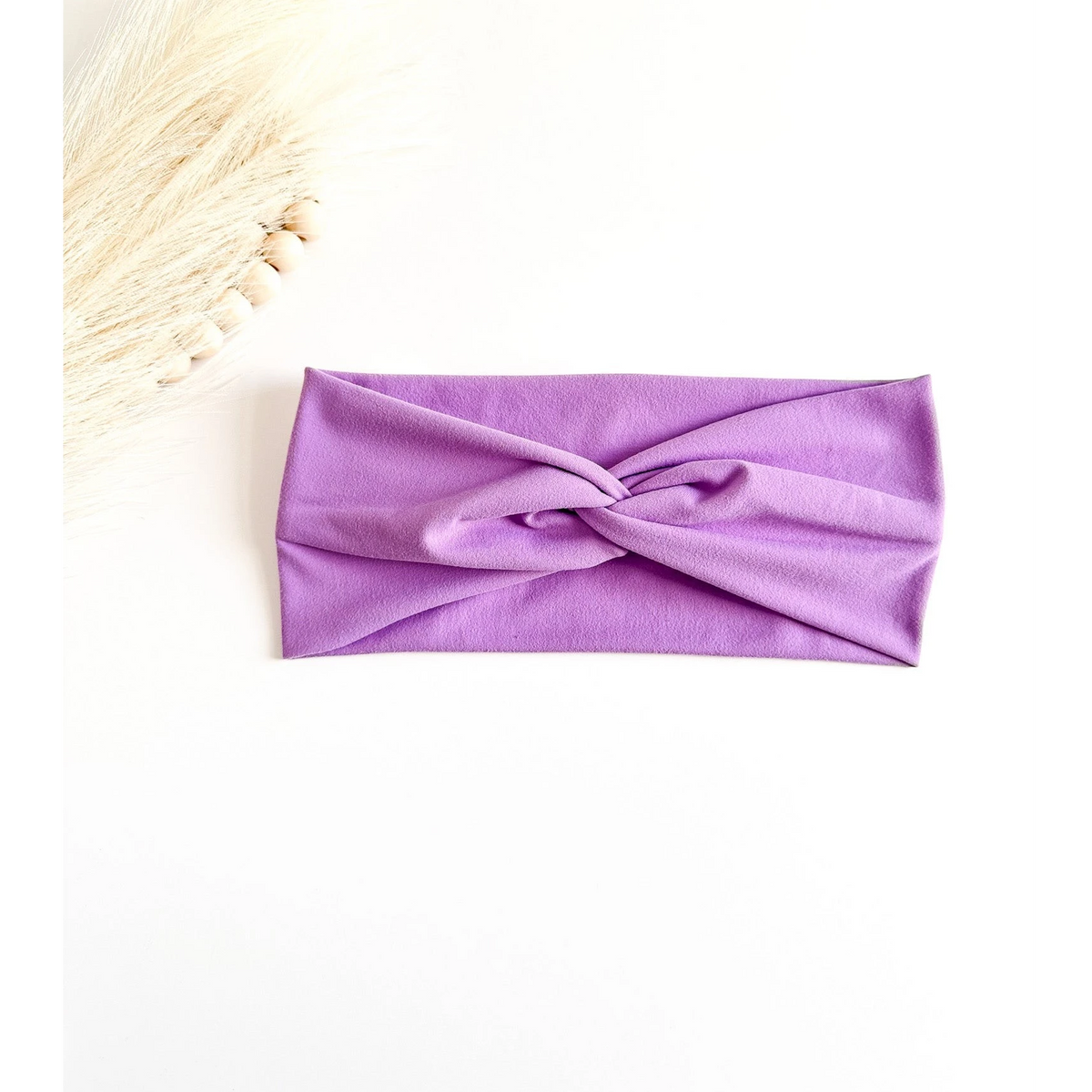 Purple headband on a white background
