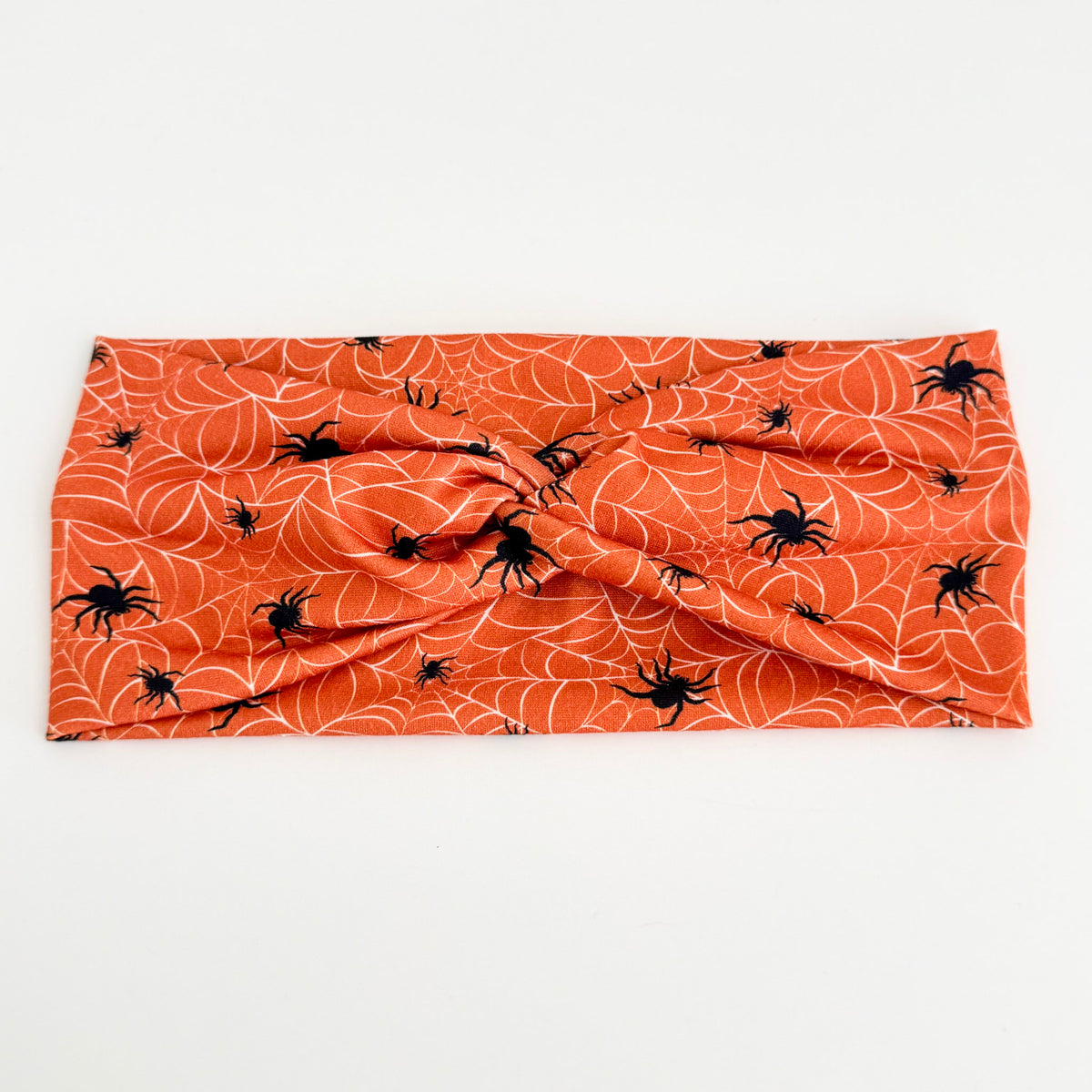Spider Webs twist headband with black spiders and webs on orange