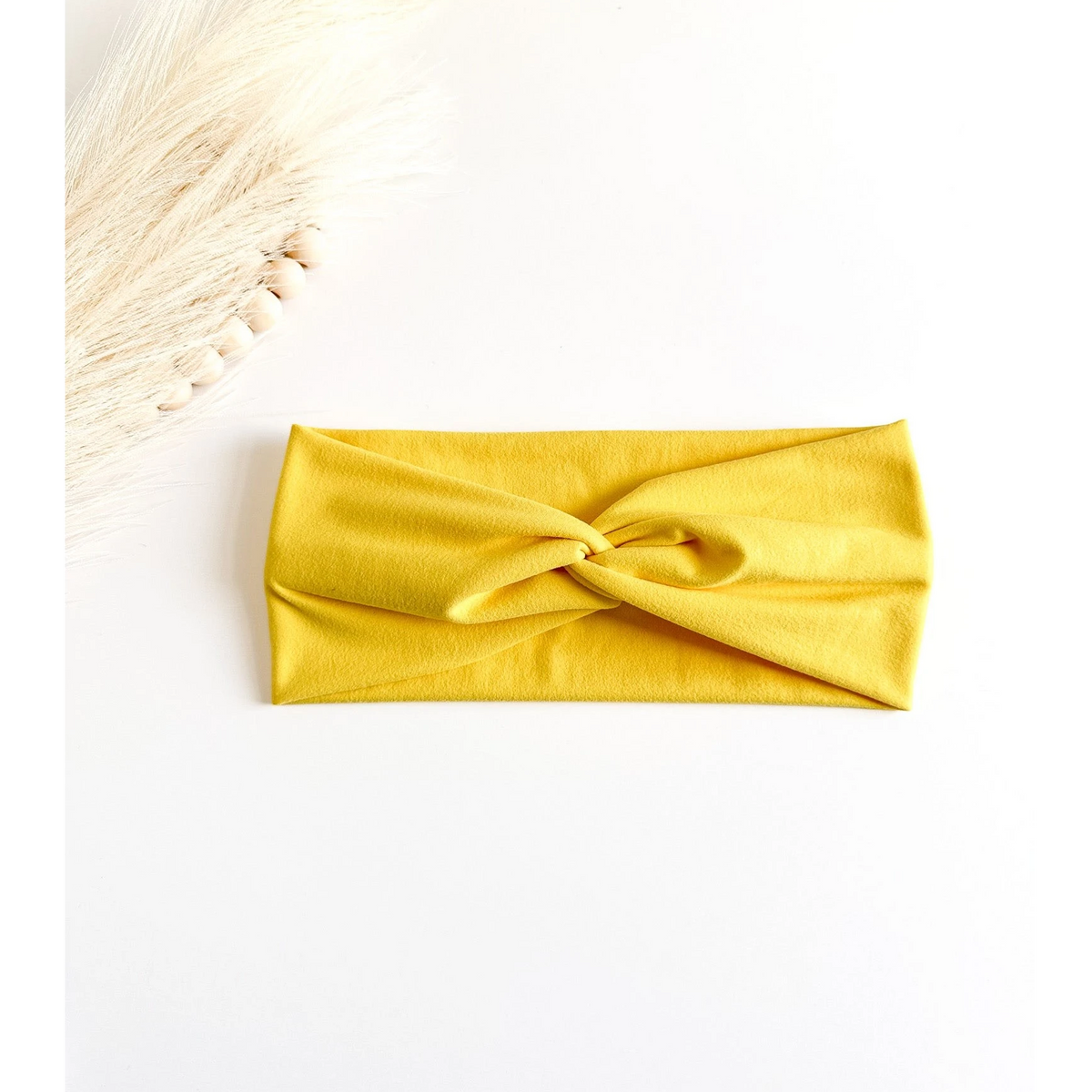 Yellow headband on a white background