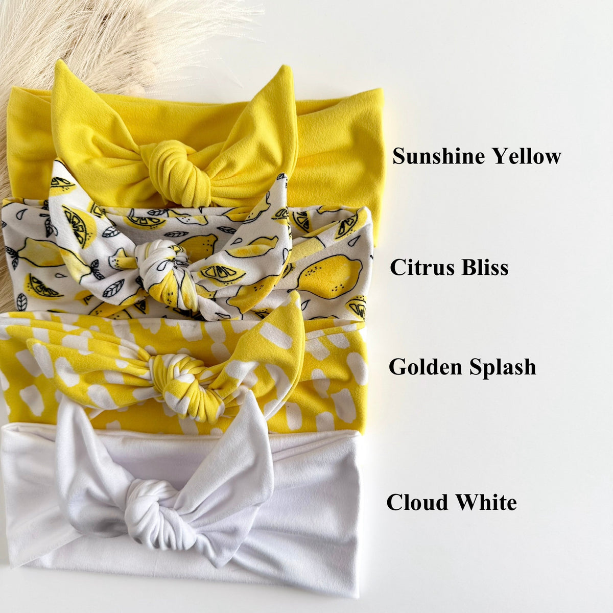 Headband Studio yellow tie headbands in Sunshine Yellow, Citrus Bliss, Golden Splash, and Cloud White.