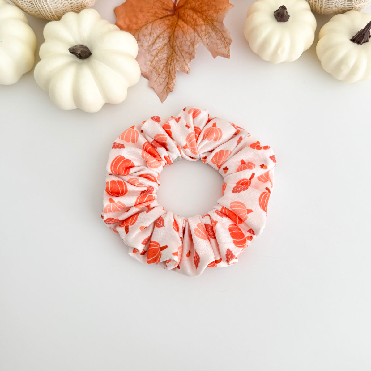 Boho Fall Pumpkins scrunchie with soft orange pumpkins on blush