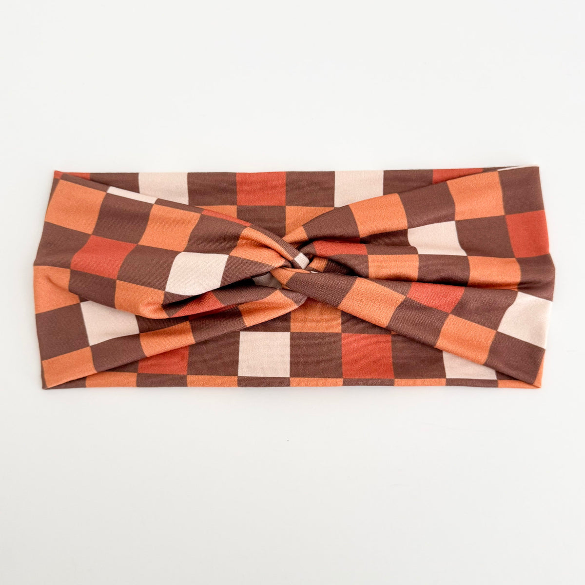 Brown Checkers twist headband in rust, brown and cream checkerboard