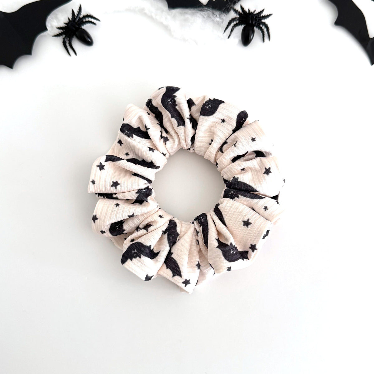Cream Bats and Stars scrunchie with black bats and stars on ribbed cream