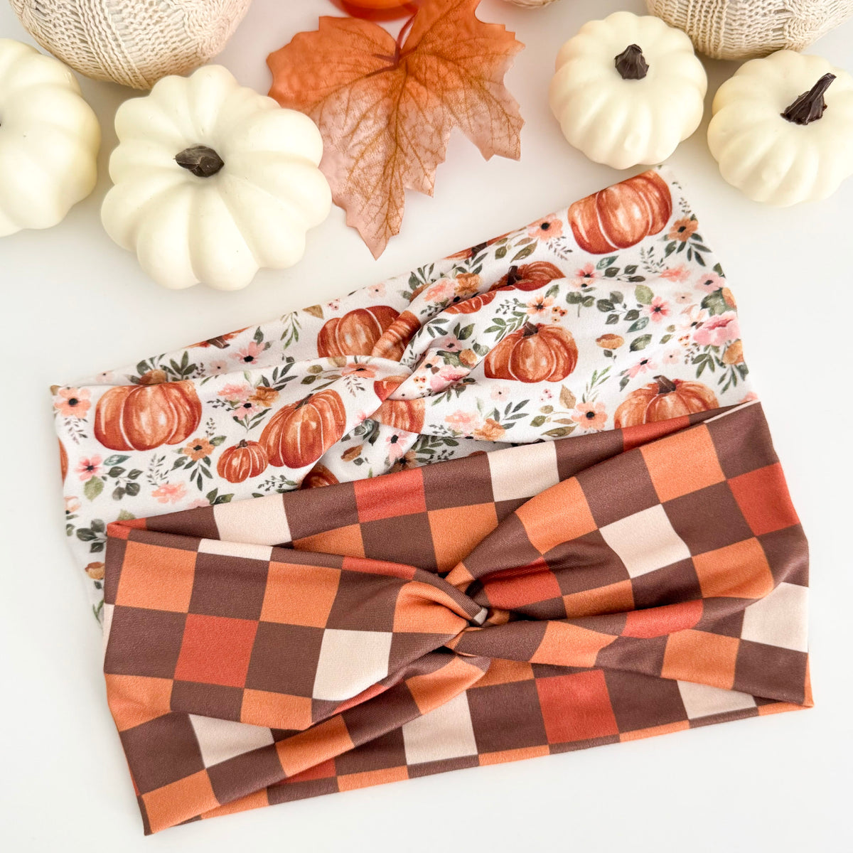 Pumpkin Pink Flowers and Brown Checkers twist headbands styled with white pumpkins and fall leaves