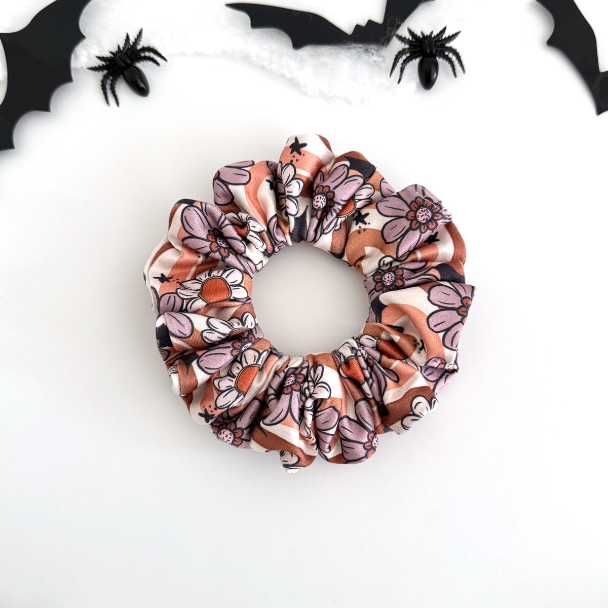 Floral Bats scrunchie with bats among retro flowers in blush and brown