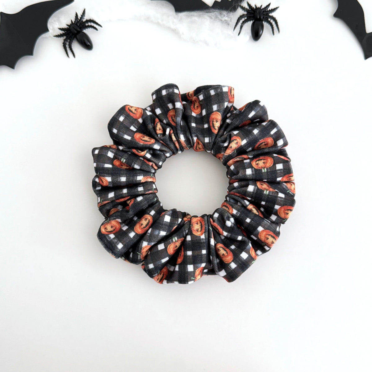 Gingham Pumpkin scrunchie with tiny pumpkins on black and white gingham