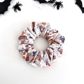 Groovy Ghost scrunchie with retro ghosts, rainbows, mushrooms and flowers