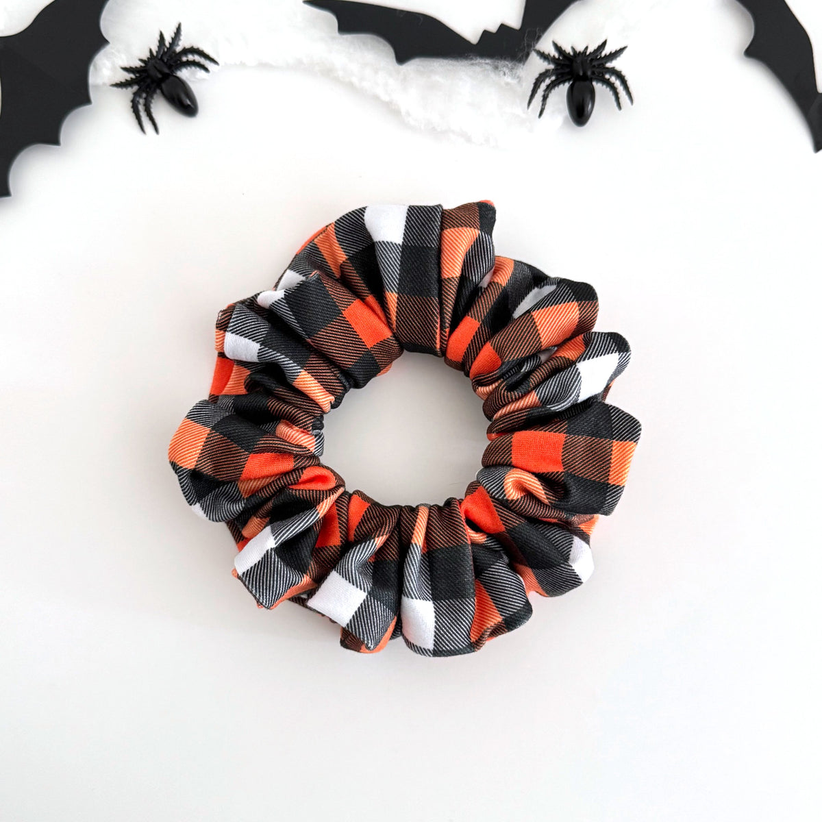 Halloween Buffalo Plaid scrunchie in orange, black and white check
