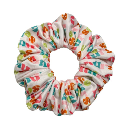 Headband Studio white scrunchie with colorful medical print, perfect for nurses and healthcare workers.