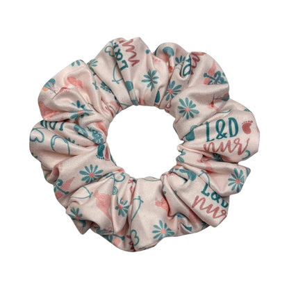 Headband Studio pink scrunchie with L&D nurse and baby foot prints, soft double brushed polyester for comfortable all-day wear.