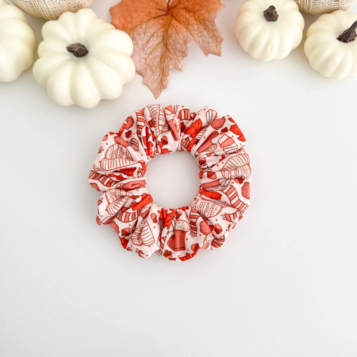 I Love Fall scrunchie with red maple leaves and sweaters on blush