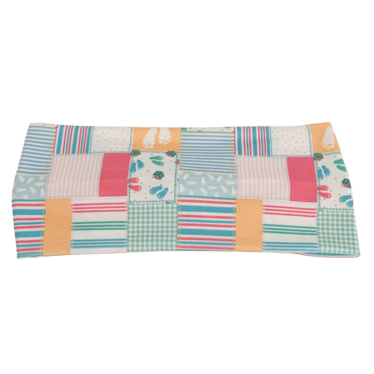Patchwork fabric panel with colorful squares on a beige background