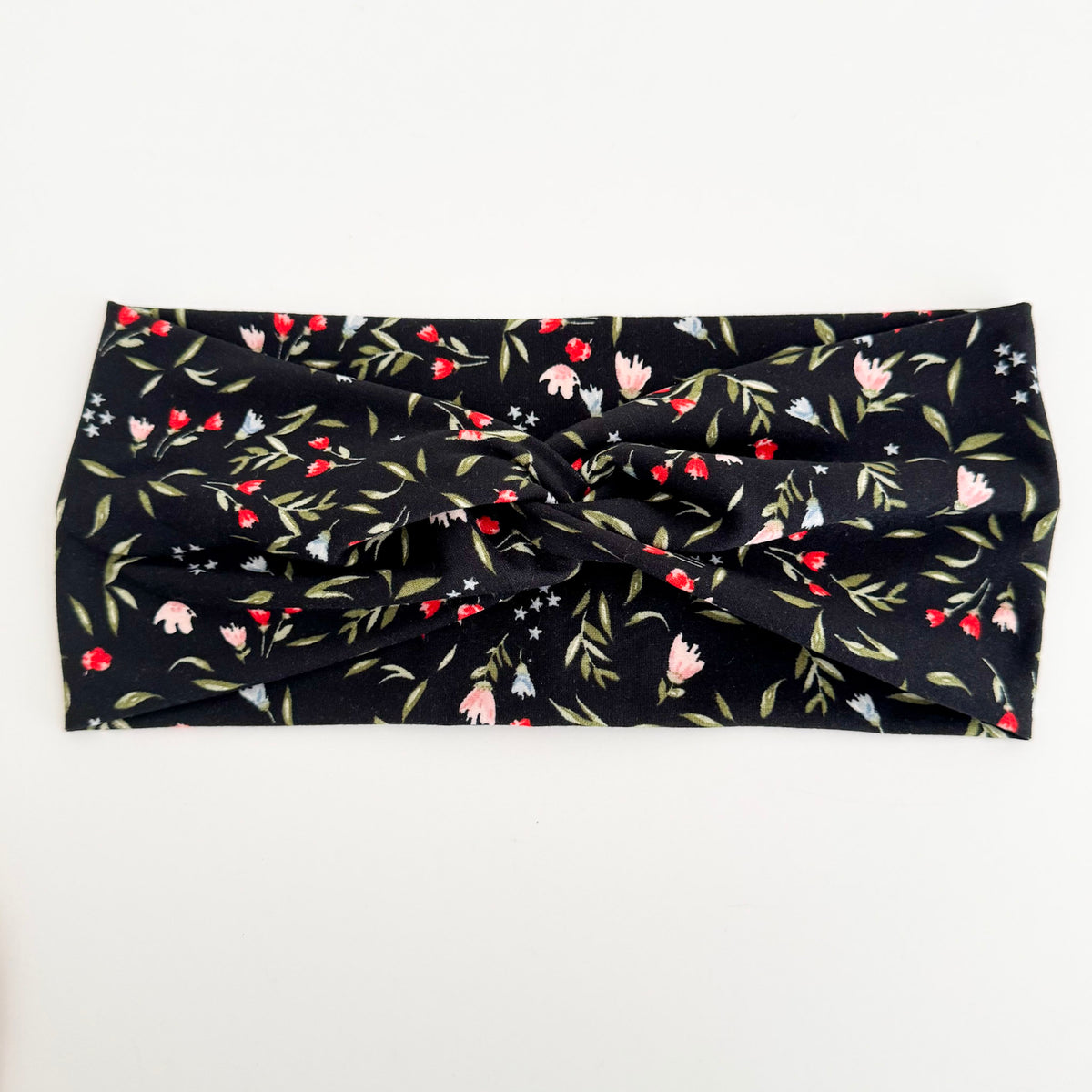 Midnight Blooms twist headband with tiny pink flowers and green leaves on black