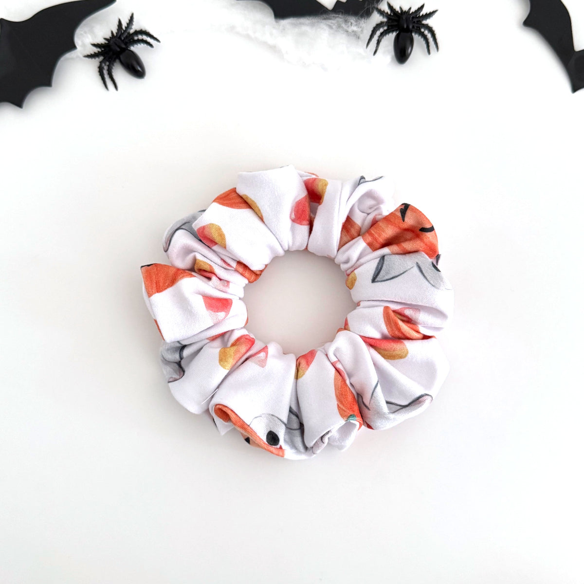 Pumpkin Ghosts scrunchie with orange pumpkins and little ghosts on white