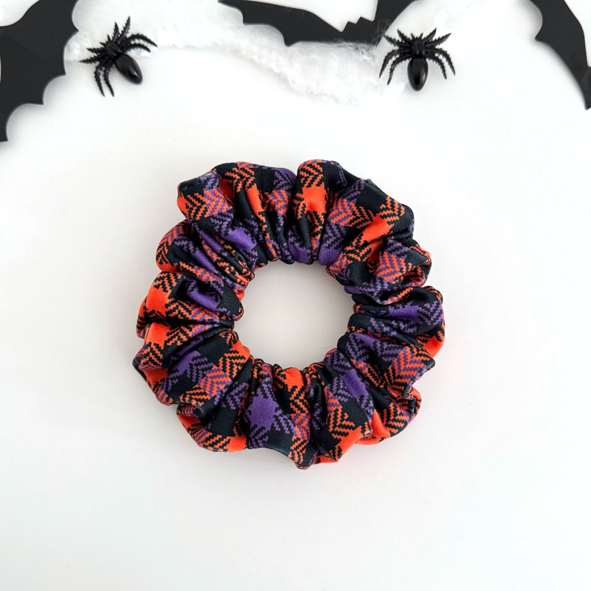 Purple and Orange Plaid scrunchie in purple, orange and black plaid