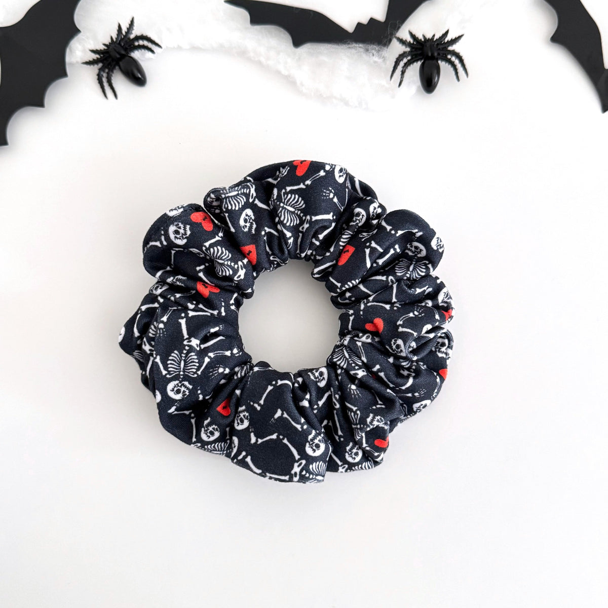 Skeleton Sweethearts scrunchie with dancing skeletons and red hearts on navy