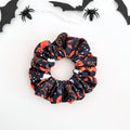 Witchy Night scrunchie with black cats, spider webs, pumpkins and ghosts on navy