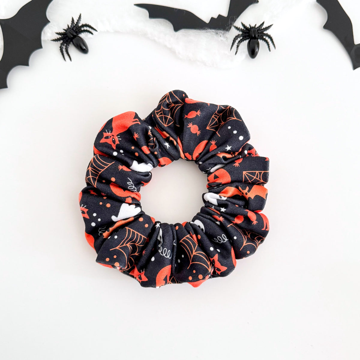 Witchy Night scrunchie with black cats, spider webs, pumpkins and ghosts on navy